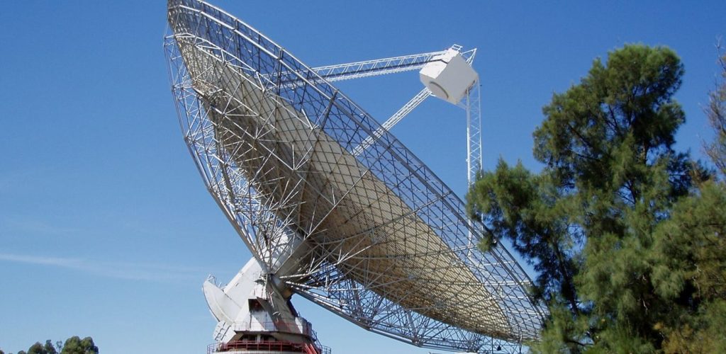 New Telescope Array Sharpens the Hunt for Fast Radio Bursts Large radio telescope dishes against the sky