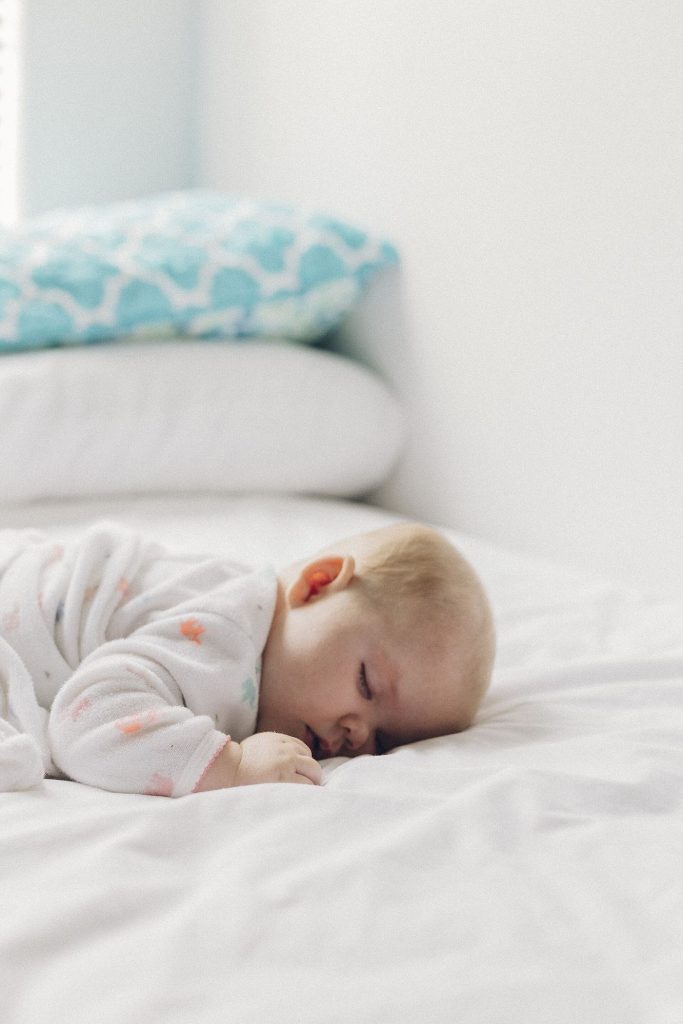 person sleeping peacefully in dark bedroom
