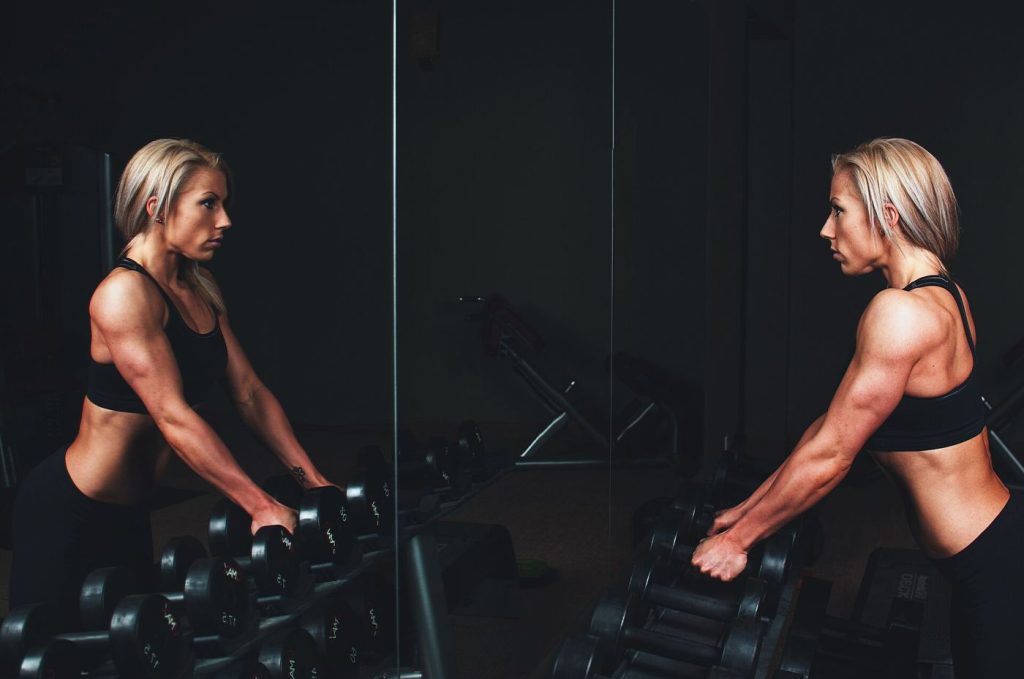 Resistance Training Protects Bone Density After Sixty Weights in a gym